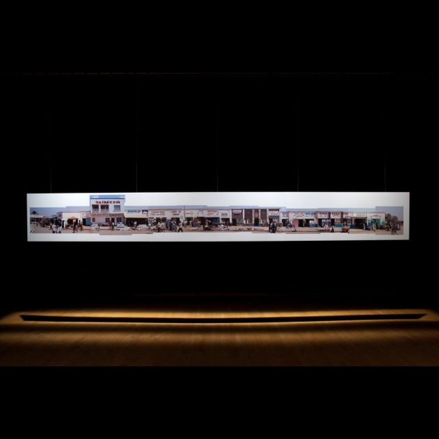 Vues des Likasi, 2005 (Installation detail.)<br>
Le Mois de la Photo à Montréal, 2009<br>
archival digital photograph on satin matte paper<br>
60 cm x 200m (installation length variable)<br>
24” x 656’ (installation length variable)
