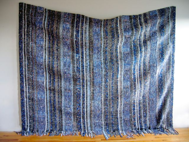 Beads re-fabricated from Barack Obama presidential campaign literature<br>
243.8 cm x 304.8 cm / 96” x 120”<br>
In collaboration with Sanaa Gateja and the Kwetu Afrika Women’s Association Angels, Uganda