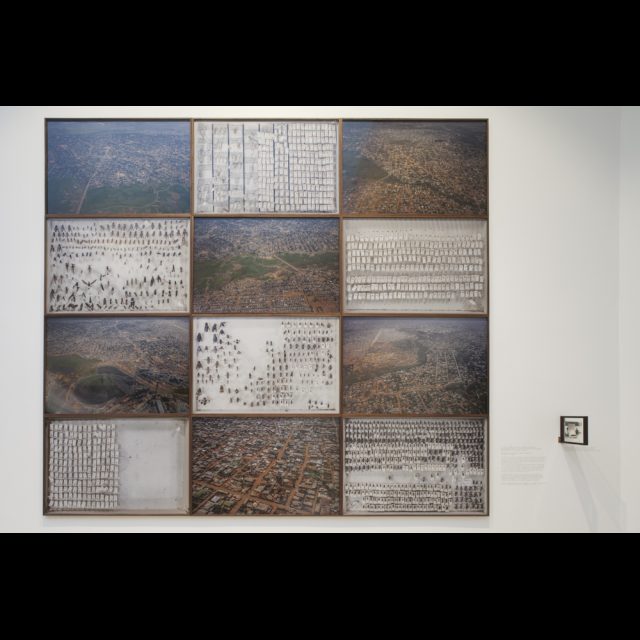 Photo essay on urban planning from 1910 to present day city of Lubumbashi, 2013<br>
Digital Inkjet print on Innova Unltra Smooth Gloss (Baryt Paper) <br>
12 components each 80 x 120 cm / 31 1/2” x 47 3/4 ” 1 component, double sided image 13 cm x 10 cm / 5 1/8” x 4”<br>
Edition: 5 + 2 AP<br>
Installation at the 56th Venice Biennale. Photo: Allesandra Bello