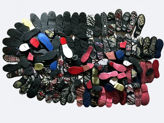 Shoe soles, paint, wire<br>
7” x 45”