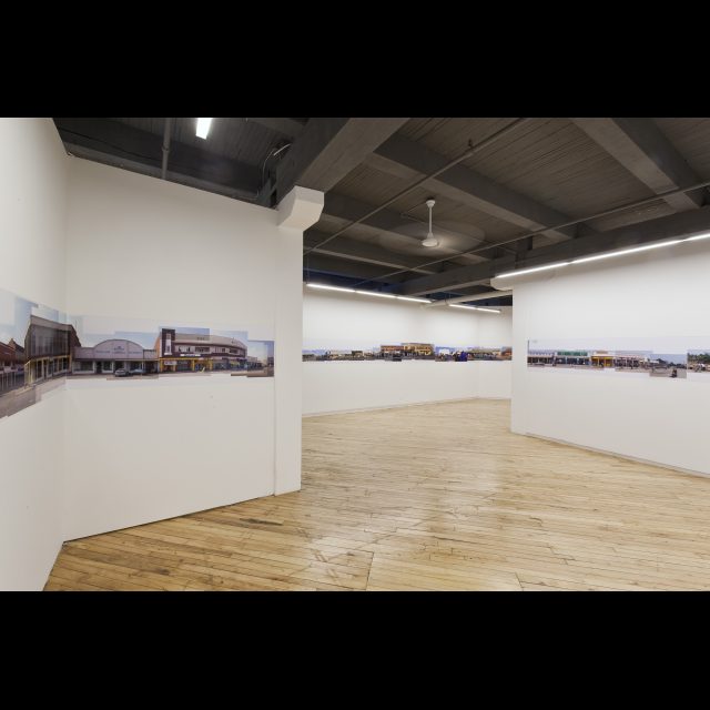 Vues des Likasi, 2005 (Installation detail.)<br>
Le Mois de la Photo à Montréal, 2009<br>
archival digital photograph on satin matte paper<br>
60 cm x 200m (installation length variable)<br>
24” x 656’ (installation length variable)