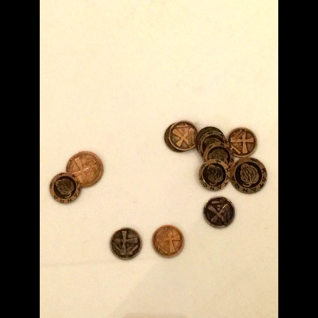 Tales of the Copper Cross Garden: Episode I (2017), installation at documenta 14, Athens<br>
Video, photographs, copper plate, copper crosses, and coins