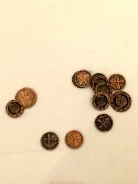 Tales of the Copper Cross Garden: Episode I (2017), installation at documenta 14, Athens<br>
Video, photographs, copper plate, copper crosses, and coins