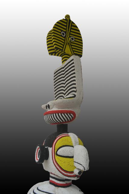 Wood, beads, glue, silicone mastic<br>
74” x 20 3/4” x 15 / 188 x 53 x 38 cm