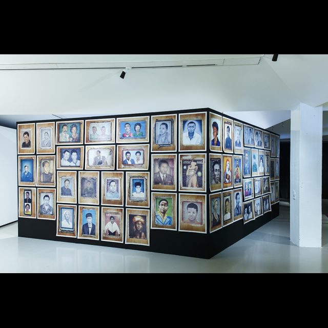 Photographs of painted portraits<br>
Installation at Framer Framed, Amsterdam. © Eva Broekema