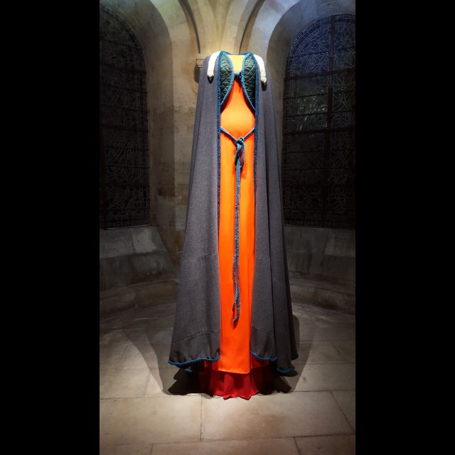 Series: Les Grand Robes Royales<br>
Height: 3 m / 9 ft<br>
Installation view, Cathedral of St. Denis, 2016. <br>
Orange cotton and jersey sweatshirt cotton coat adorned with dark green damask and woolen gray cloth cape, and knit belt. An h'ermine fur is thrown over the shoulders. <br>
Collaboration with: Castille Schwartz <br>