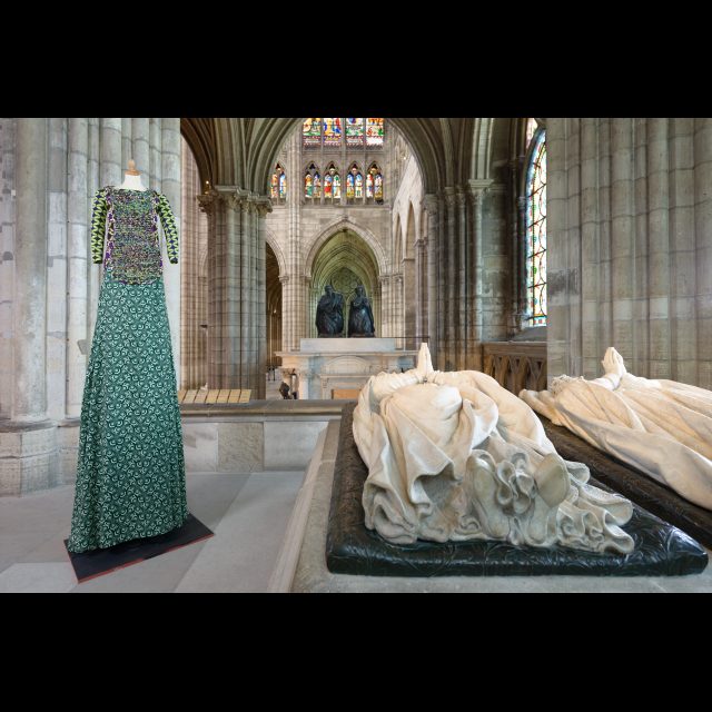 Series: Les Grand Robes Royales<br>
Height: 3 m / 9 ft<br>
Installation view, Cathedral of St. Denis, 2016. <br>
The outfit combines different shades of green wax print; the breastplate is knitted with wax print offcuts.<br>
Collaboration: Céline Destouches