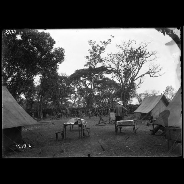 Zilo, 1899. Camp at the Zilo Falls on ration distibution day. François Michel.<br>
80 cm x 110 cm<br>
Archival digital photograph on Hahnemühle Paper<br>
Edition: 5 + 1 AP