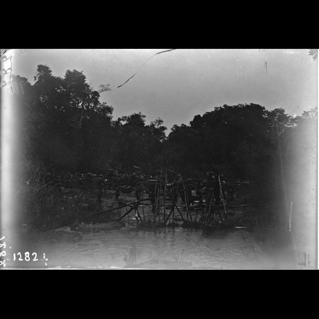 Kuleshi, 1899. Bridge over the river to chief Tam-wana's village, Kukechi. François Michel.<br>
80 cm x 115 cm<br>
Archival digital photograph on Hahnemühle Paper<br>
Edition: 5 + 1 AP
