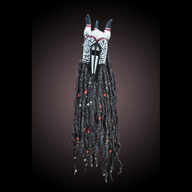 Bamileke Yegué Dogon Crocodile Mask, 20<br>
Wood, hair, beads, buttons, cowries, pigment and cloth <br>
140 x 20 x 23 cm