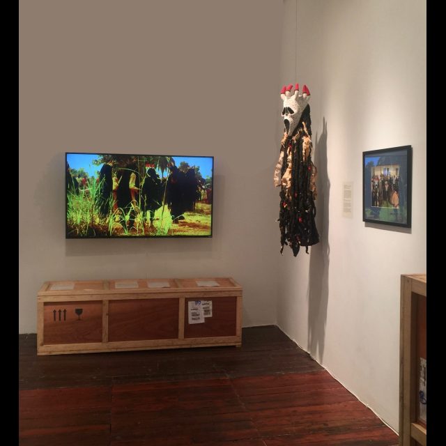 Two-faced / Double visage, 2015-2017
Series: Visages de masques (II)
Multimedia installation including:
Bamiléké Yegué Scream Mask, 2015 - 2017
wood, hair, beads, hide, pigment and cloth
Visages de masques II
Video. Duration: 3:45.
dimensions variable.
Ed: 1 + 1 AP
Shipping crate
wood, metal hardware.
46 ¼” x 22 ¼” x 22 ¼”
Field photograph
Fine Art pigment print on Epson Hot Press Cotton Rag 330 gsm paper
38 cm x 48.3 cm / 15” x 19”
Edition: 5 +2 AP
Museum labels, shipping documents