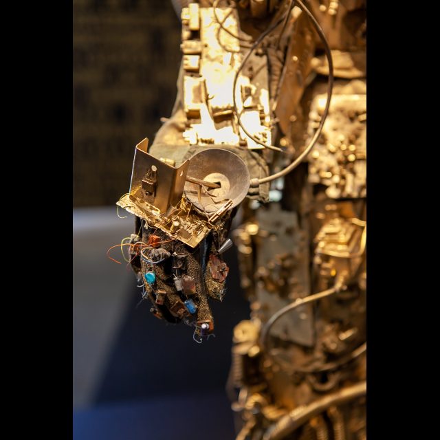 <i>SPACEWALKER GEN-9</i>, 2020-2022<br>
SCrashed_Capital series<br>
Multimedia – electronic circuits, fabric, wire, found objects, and gold spray paint<br>
Photo © Rachel Kabukula