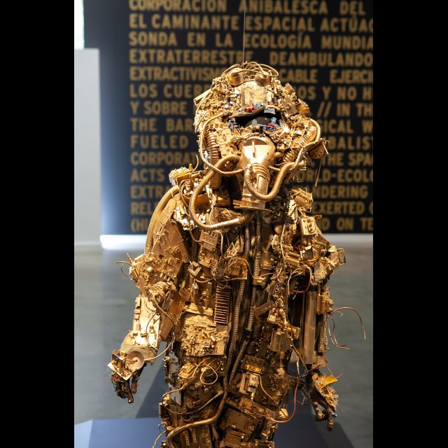 <i>SPACEWALKER GEN-9</i>, 2020-2022<br>
SCrashed_Capital series<br>
Multimedia – electronic circuits, fabric, wire, found objects, and gold spray paint<br>
Installation view at the College of Art and Design, University of North Texas, Denton<br>
Photo © Rachel Kabukula